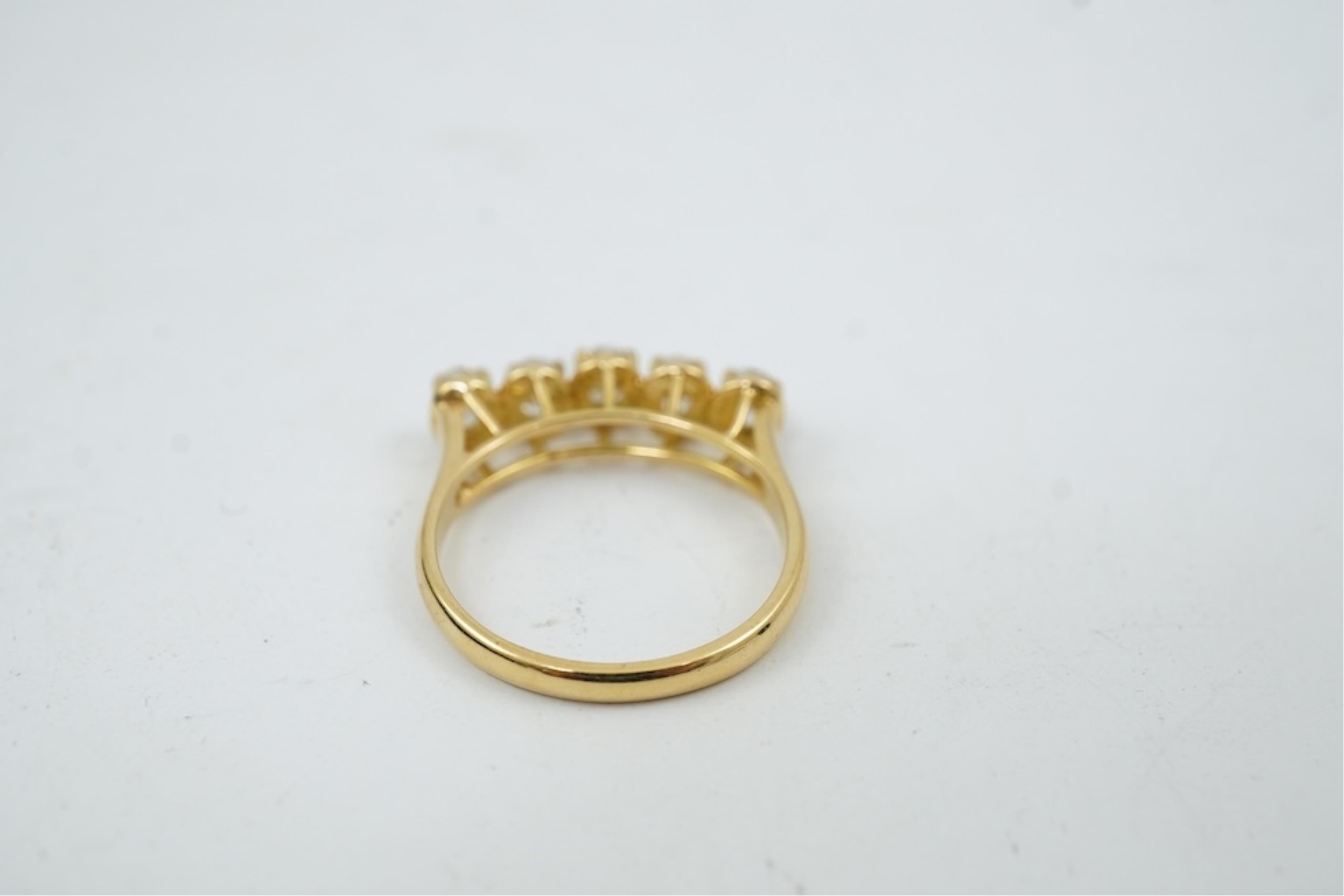 A modern 18ct gold and five stone oval cut diamond set half hoop ring, size N, gross weight 3.8 grams.